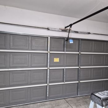 Garage-O-Matic - Inside of a garage door with torsion springs above. - Garage Door Services Near Me Garage-O-Matic - Inside of a garage door with torsion springs above. - Garage Door Services Near Me