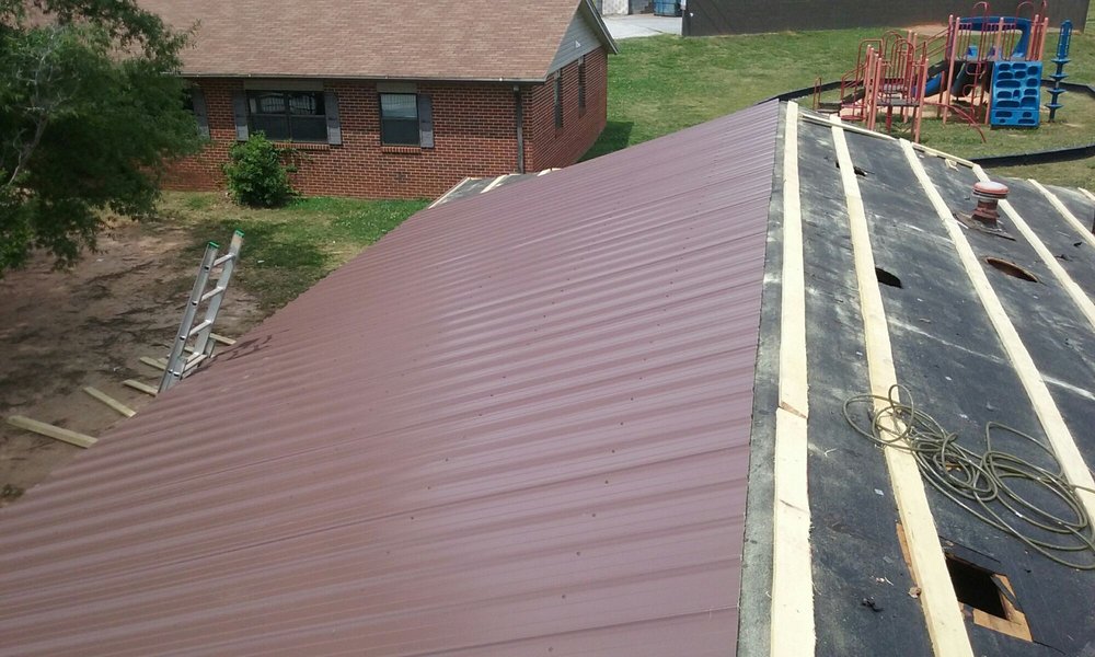 Slide of Tim's Roofing