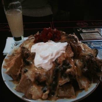 Vintage Brewing - Massive nacho platter. More than enough hearty food for three people to enjoy... - Breweries Near Me - Madison, Wisconsin Vintage Brewing - Massive nacho platter. More than enough hearty food for three people to enjoy... - Breweries Near Me - Madison, Wisconsin