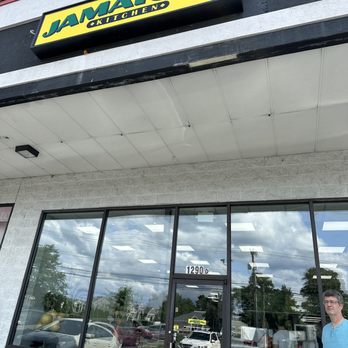Jamaican Kitchen - a man standing in front of a restaurant - Caribbean Near Me - Bristol, Connecticut