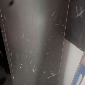 Grizzly Construction Services - Drywall mud on poster and dresser - General Contractors Near Me
