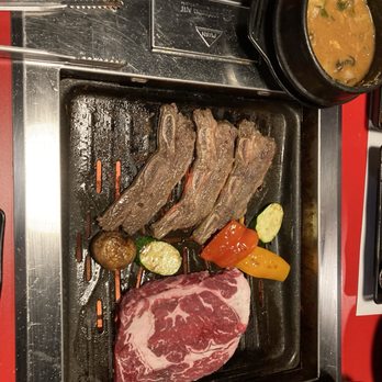 Goong - a grill with meat and vegetables on it - Barbeque Near Me - Springville, Utah