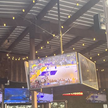 Little Woodrow's Tomball - Tv screens over the bar area - Sports Bars Near Me - Tomball, Texas