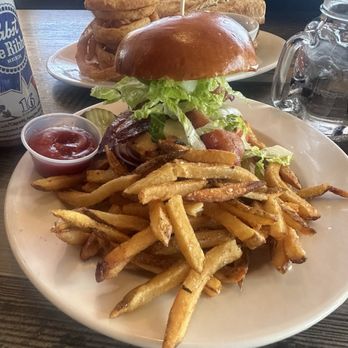 Duffy's Tavern & Grill - Grilled chicken sandwich with fries, behind it is the French dip with rings.(not great photo of French dip) - American Near Me - Kennebunk, Maine Duffy's Tavern & Grill - Grilled chicken sandwich with fries, behind it is the French dip with rings.(not great photo of French dip) - American Near Me - Kennebunk, Maine