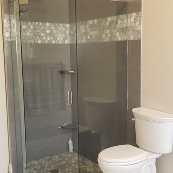 Van Cott Flooring - a bathroom with a toilet and shower - Flooring Near Me - Boynton Beach, Florida