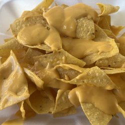 Tito & Teresa Restaurant - $7 chips and queso. . . Yes, it tastes exactly like the cheese from Taco Bell or a school concession stand.