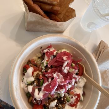 CAVA - Chicken grain bowl and pita chips - Mediterranean Near Me - Seminole, Florida