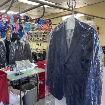 Holiday Cleaners - Suit jacket with store in background - Dry Cleaning Near Me - Milpitas, California
