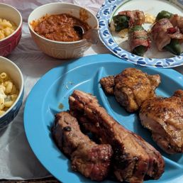 Pork ribs, chicken, mac n cheese, beans, jalapeno poppers, and mac salad Pork ribs, chicken, mac n cheese, beans, jalapeno poppers, and mac salad