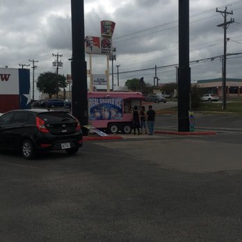 Lighthouse Shaved Ice - a car parked in front of a sign - Shaved Ice Near Me - San Antonio, Texas Lighthouse Shaved Ice - a car parked in front of a sign - Shaved Ice Near Me - San Antonio, Texas