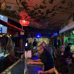 a group of people sitting at a bar