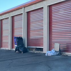 CubeSmart Self Storage - Storage tenants with their belongings outside their unit as they come and go during the day (everyday occurrence).