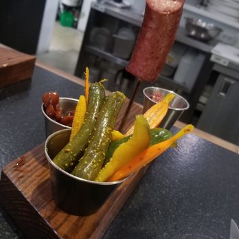 Apis Restaurant - Smoked sausage, homemade sauerkraut, homemade pickled veggies, glazed cashews, and a mustard - Venues & Event Spaces Near Me - Kenosha, Wisconsin