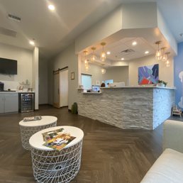 Comfortable lobby. Kid area to the right, fridge and coffee to the left.