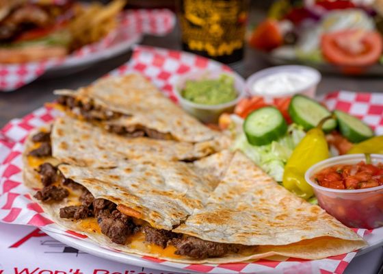 Catering for A party of 100 guests - For Only $1450+ Tax This package includes unlimited tacos, quesadillas, rice and beans with 3 hours of catering services with your choice of 3 meats 3 beverages.  Salsa bar & toppings, chips, plates, cups and silverware included.