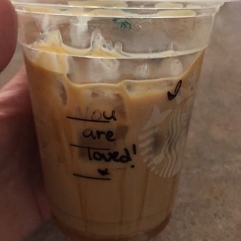 Starbucks - a hand holding a cup of iced coffee - Coffee & Tea Near Me - Surprise, Arizona Starbucks - a hand holding a cup of iced coffee - Coffee & Tea Near Me - Surprise, Arizona