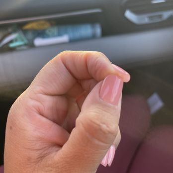 Bee Nails & Spa - My thumb nail is at the bottom of my actual nail , from there up is all glue they used between my nail and gel x nail - Nail Salons Near Me - Riverside, California