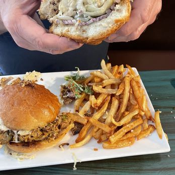 Loungin' Lizard - Spicy BBQ pulled pork sandwich is so tasty you'll be smiling $$18 yum - Cocktail Bars Near Me - Cortez, Colorado Loungin' Lizard - Spicy BBQ pulled pork sandwich is so tasty you'll be smiling $$18 yum - Cocktail Bars Near Me - Cortez, Colorado