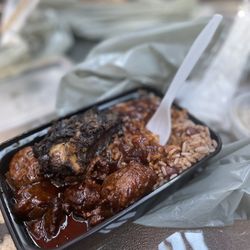 Stew chicken and a piece of jerk chicken