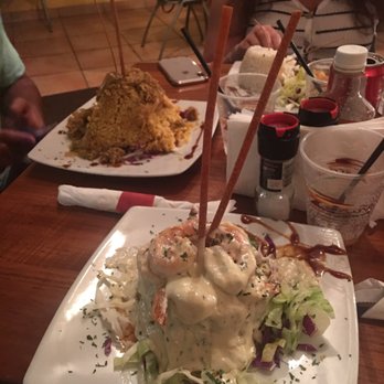 Terruño - Shrimp mofongo in the background rice with crab meat. - Caribbean Near Me - Luquillo, Puerto Rico Terruño - Shrimp mofongo in the background rice with crab meat. - Caribbean Near Me - Luquillo, Puerto Rico