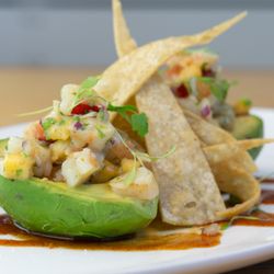Shrimp Stuffed Avocado
Fresh avocado filled with chilled shrimp, stone fruit, onions, and garden-fresh herbs.