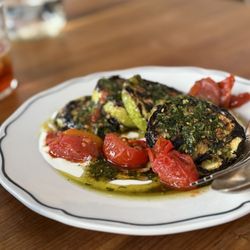 Grill squash and cherry tomatoes with yogurt and za'atar oil