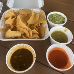 Homemade tortilla chips, guacamole, spicy salsa, salsa verde, homemade taco sauce Homemade tortilla chips, guacamole, spicy salsa, salsa verde, homemade taco sauce