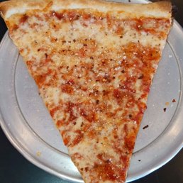 a slice of pizza on a plate a slice of pizza on a plate
