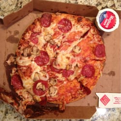 Domino's Pizza - Just the way it was delivered...cheese and toppings all piled in the side of the box, thanks Domino's!