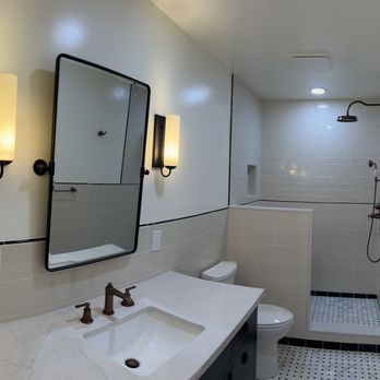 Spgconstruction - a bathroom with a sink, toilet, and shower - General Contractors Near Me Spgconstruction - a bathroom with a sink, toilet, and shower - General Contractors Near Me