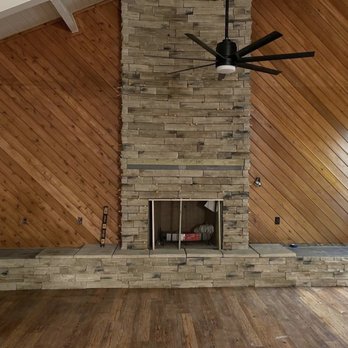 Smr Flooring - a fireplace in a living room - Flooring Near Me Smr Flooring - a fireplace in a living room - Flooring Near Me