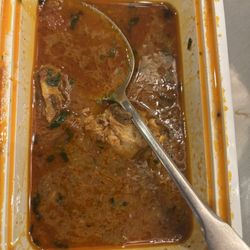 Gorkhali Kitchen Tampa - The container is half full with bones and sauce