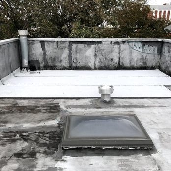 William & Hugh Roofing - During (Rear view) - Extra layers to pitch the water towards the drain by the chimney - Roofing Near Me - Sunnyside, New York
