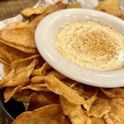 Hurricane Grill & Wings - Old Bay Kettle Chips & Queso - Crispy kettle chips w/ Old Bay seasoning, creamy queso w/ hint of jalapeño & red pepper