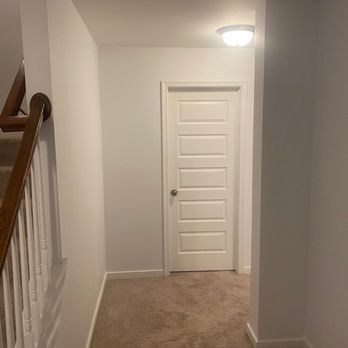We Know Homes - a hallway leading to a second floor - General Contractors Near Me