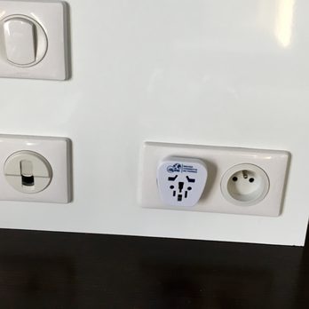 Grand Hôtel Saint Michel - Detail: universal plug adapter in the guest room - Hotels Near Me - Paris, 75