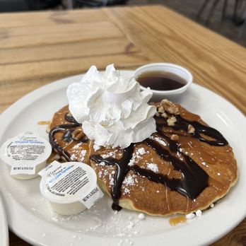 Willie's Family Restaurant - a plate of pancakes with whipped cream and syrup - American Near Me - Fort Wayne, Indiana Willie's Family Restaurant - a plate of pancakes with whipped cream and syrup - American Near Me - Fort Wayne, Indiana