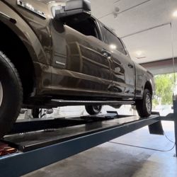 GMT Auto Service & Tires - Truck on lift