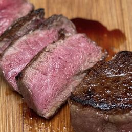 a piece of steak on a cutting board a piece of steak on a cutting board
