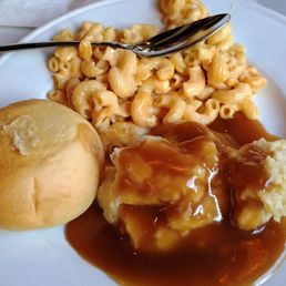 Bread, mashed potato and gravy, and macaroni and cheese