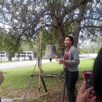 Whitney Plantation - Our tour guide Yvonne in front of the bell. - Museums Near Me - Wallace, Louisiana Whitney Plantation - Our tour guide Yvonne in front of the bell. - Museums Near Me - Wallace, Louisiana