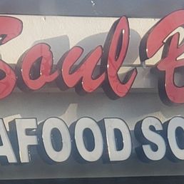 a sign for a seafood restaurant a sign for a seafood restaurant