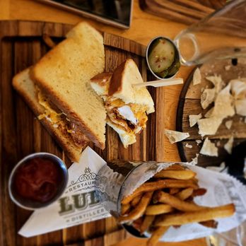 Lula Restaurant Distillery - Spicy fried chicken sandwich with fig spread, sweet and spicy. - Southern Near Me - New Orleans, Louisiana Lula Restaurant Distillery - Spicy fried chicken sandwich with fig spread, sweet and spicy. - Southern Near Me - New Orleans, Louisiana