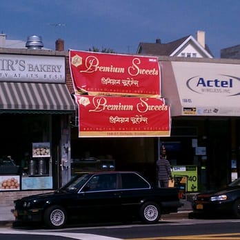 Premium Sweets - a black car parked in front of a store - Indian Near Me - Queens, New York Premium Sweets - a black car parked in front of a store - Indian Near Me - Queens, New York