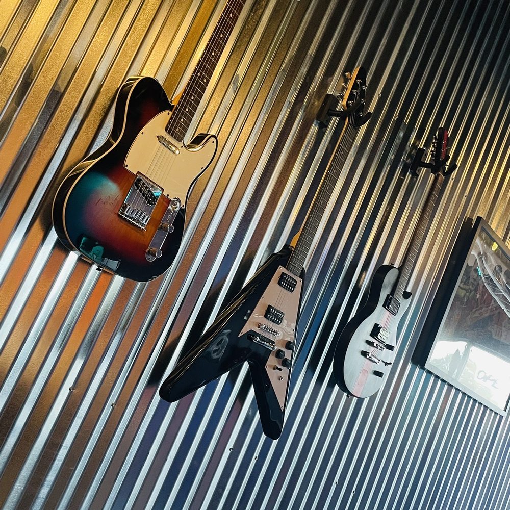 Classic Rock Coffee - guitars hanging on a wall - Coffee & Tea Near Me - San Antonio, Texas
