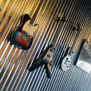 Classic Rock Coffee - guitars hanging on a wall - Coffee & Tea Near Me - San Antonio, Texas