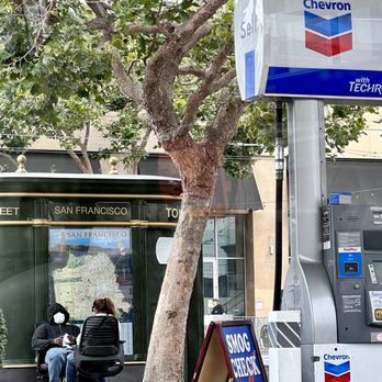 Chevron - two people sitting on a bench in front of a gas station - Gas Stations Near Me - San Francisco, California Chevron - two people sitting on a bench in front of a gas station - Gas Stations Near Me - San Francisco, California