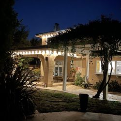 Mena's Christmas Lighting - Samuel and his team did a great job of installing permanent LED lights on the roof perimeter and on trees.
