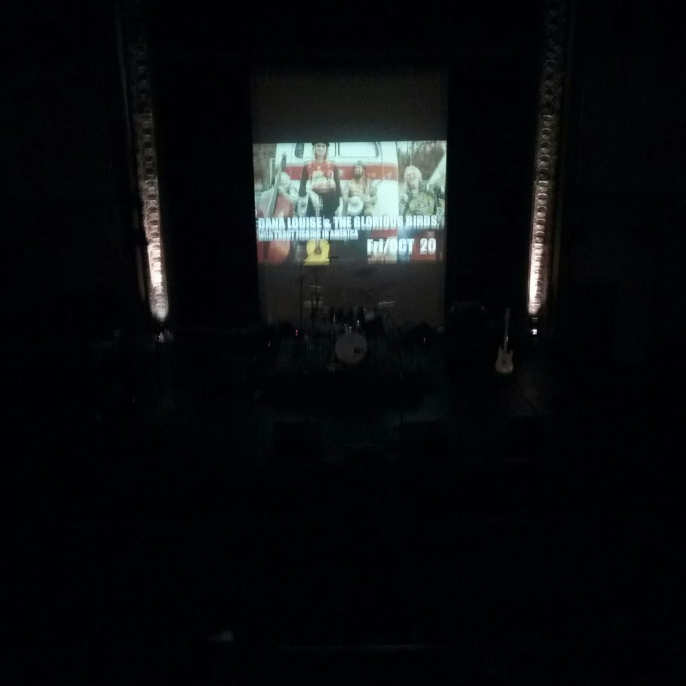 a stage with a large screen a stage with a large screen