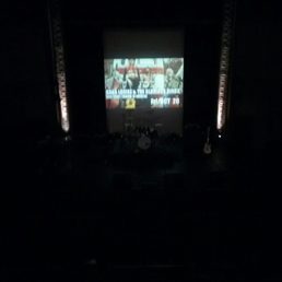 a stage with a large screen a stage with a large screen